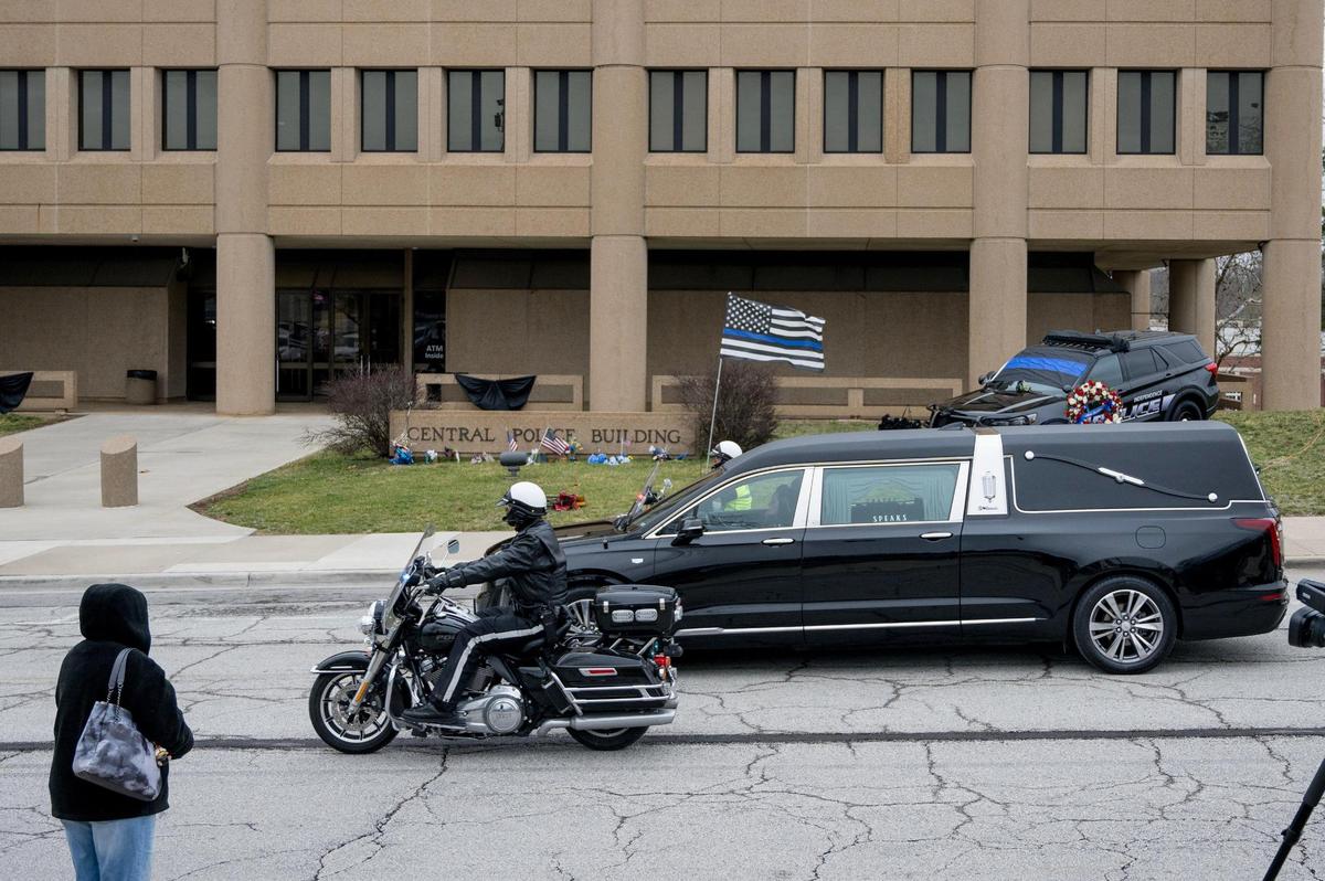 The funeral procession for Independence police officer Cody Allen passes by police headquarters on Friday, March 8, 2024, in Independence. Allen was fatally shot during an eviction in northeast Independence last week.