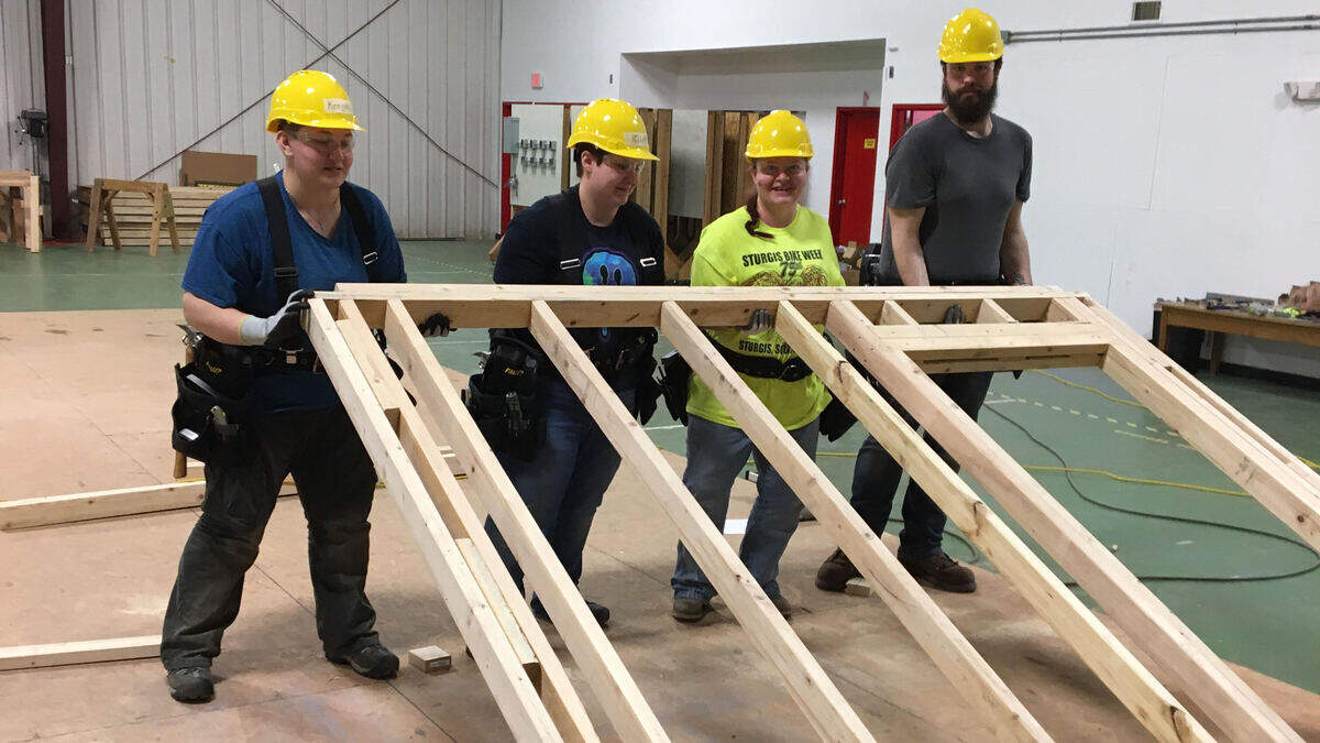 During a recent carpentry training class, Construct KC students practiced raising a wall. A joint project of the Kansas City-area construction industry and Kansas Workforce Partnership, Construct KC is a program in which students from the Johnson County Department of Corrections complete a 12-week hands-on carpentry curriculum to prepare them for employment in a variety of construction trades.