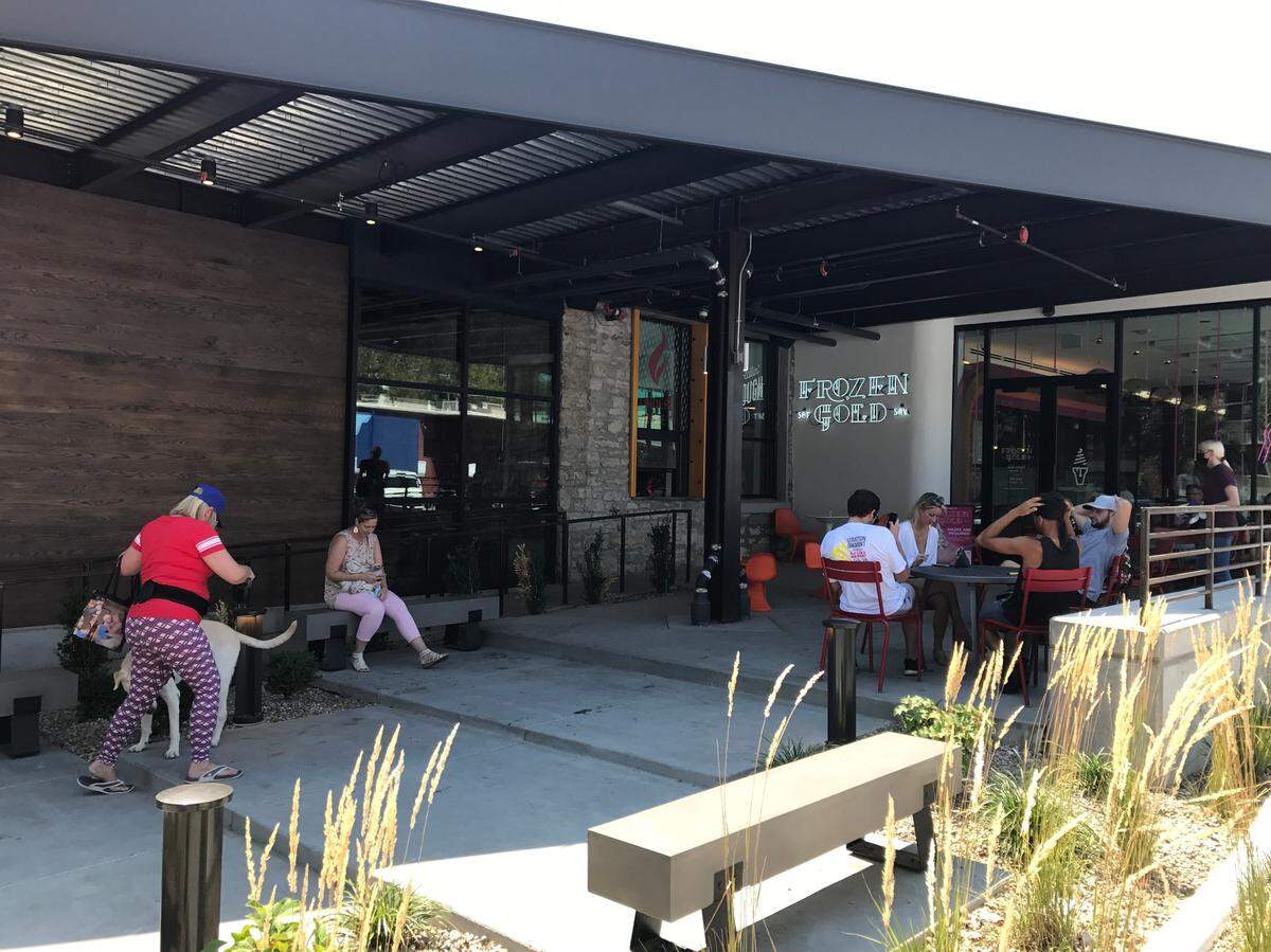 A new Westport complex with four concepts  — Atomic Cowboy bar, Denver Biscuit Co., Fat Sully’s and Frozen Gold  — has two outdoor seating areas. 