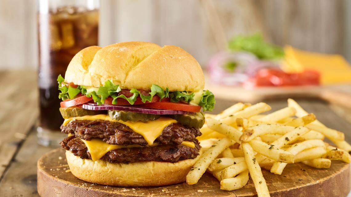 Smashburger’s double classic burger with American cheese, lettuce, tomato, red onion, pickles, ketchup and its special sauce on a toasted bun, along with Smashfries.
