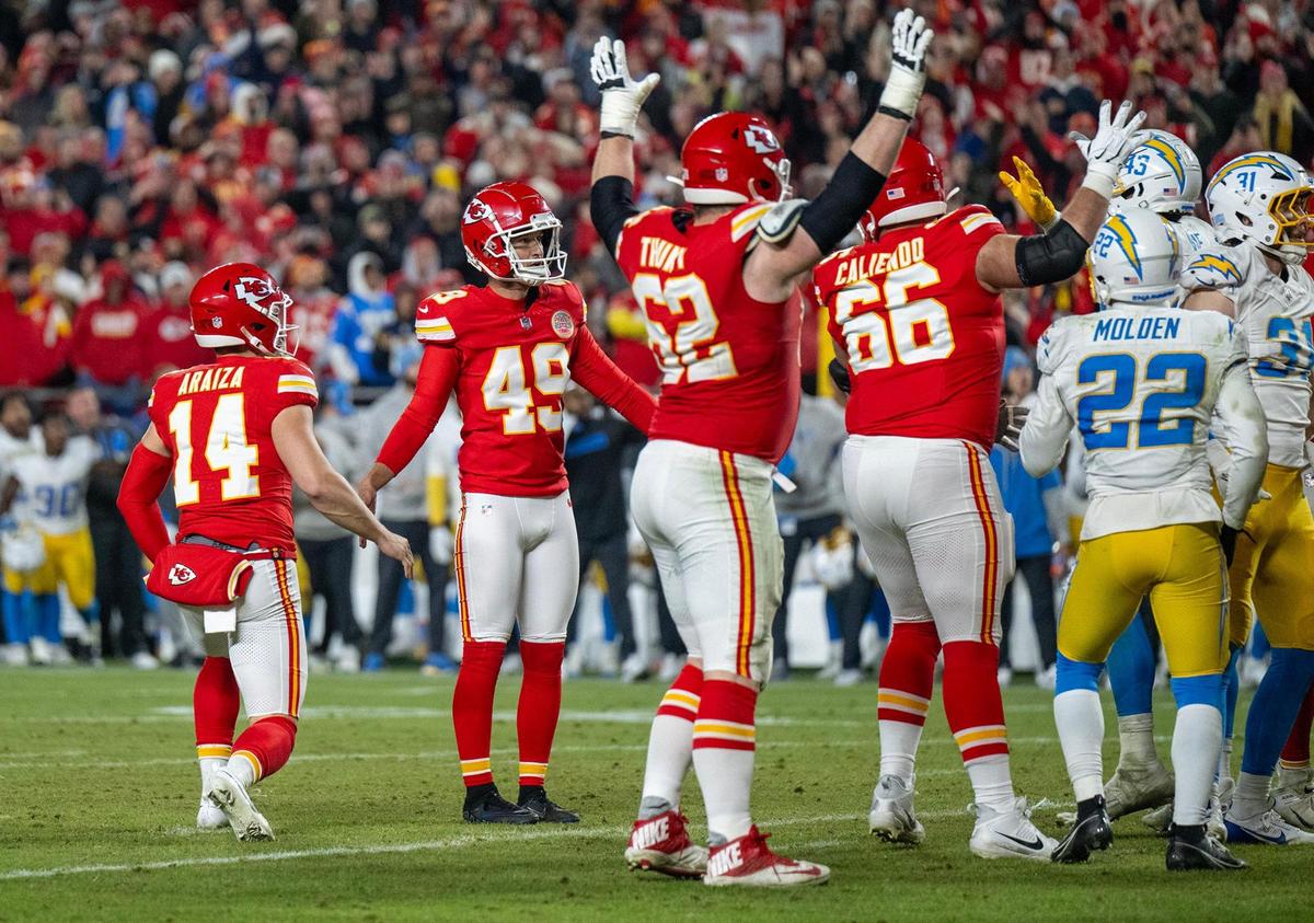 Kansas City Chiefs punter Matt Araiza (14) and place kicker Matthew Wright (49) watch as the winning field goal gives the Chiefs a 19-17 win over the Los Angeles Chargers In the second half on Sunday, Dec. 8, 2024, at GEHA Field at Arrowhead Stadium.