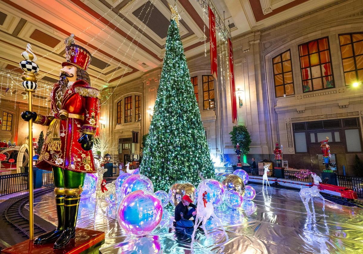 Steve Uhlir of Cleveland, Ohio, works on the reindeer in the display around a 30-foot tall Christmas tree at the “Holiday Reflections” display in Union Station’s Grand Plaza, Wednesday, Nov. 13, 2024. This years’ holiday spectacular, which takes five weeks to set up, features several new displays, lighted photo-op and immersive exhibits. Holiday Reflections opens on Friday, Nov. 22, 2024.
