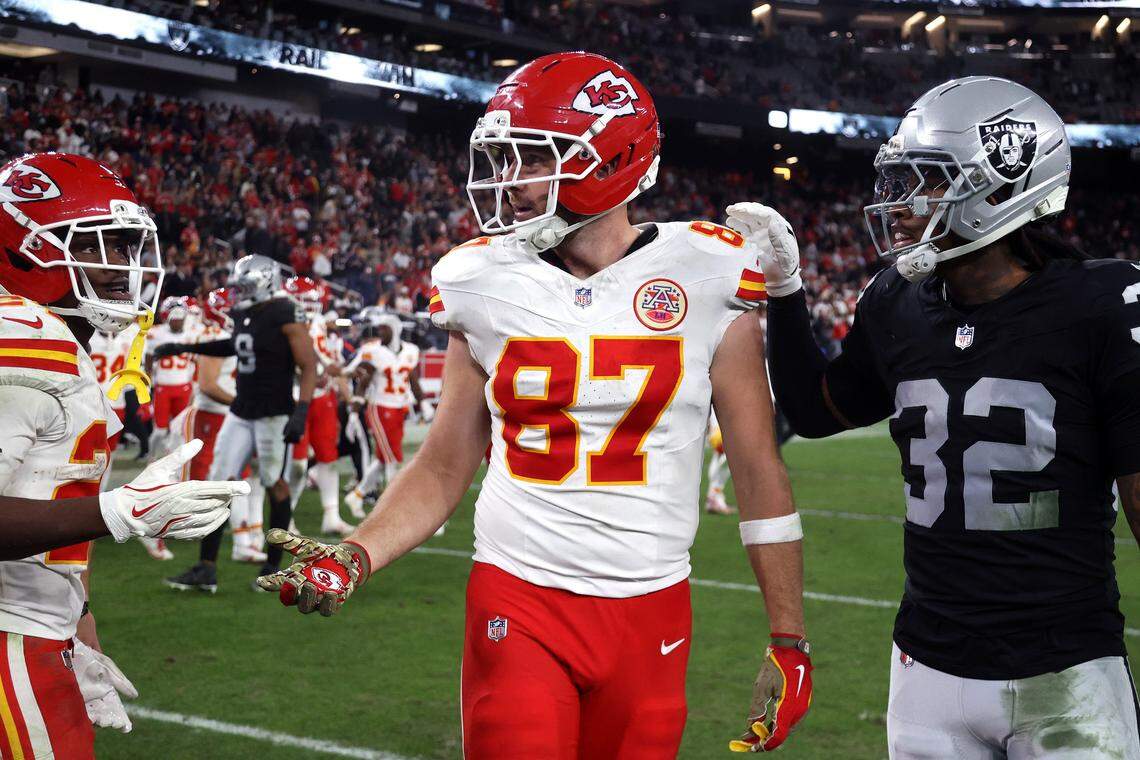 Kansas City Chiefs tight end Travis Kelce (No. 87) is greeted by Raiders cornerback Lonnie Johnson Jr., right, after an NFL Week 18 game at Allegiant Stadium in Las Vegas on Sunday, Jan. 4, 2026.