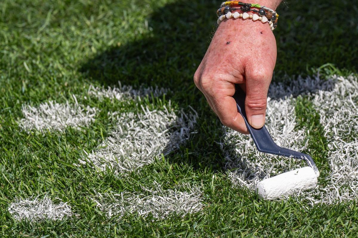 The MLB Opening Day logo required several coats of paint on the field at Kauffman Stadium on Tuesday, March 25, 2025. Crews worked throughout the day to prepare for Opening Day for the Kansas City Royals.