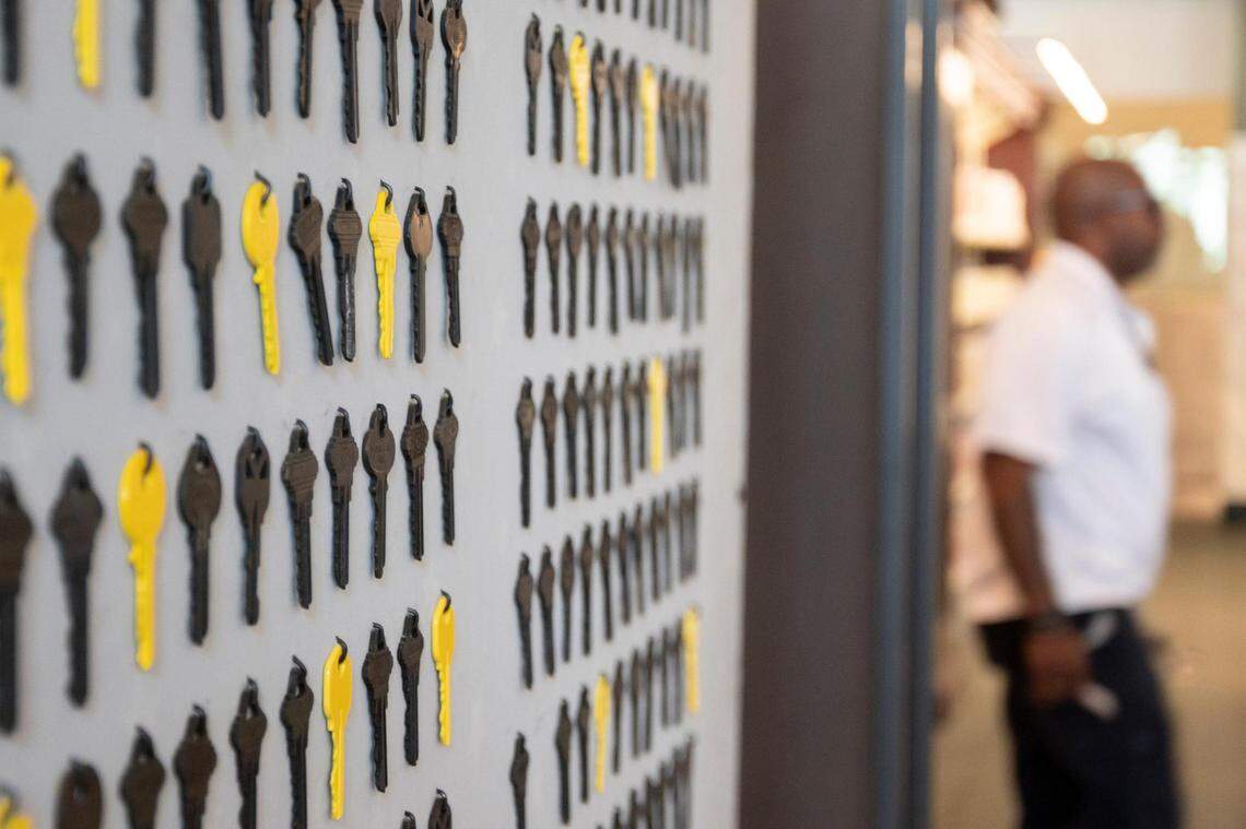 Yellow and black house keys illustrate the statistic that​ Black women are most at risk of eviction.