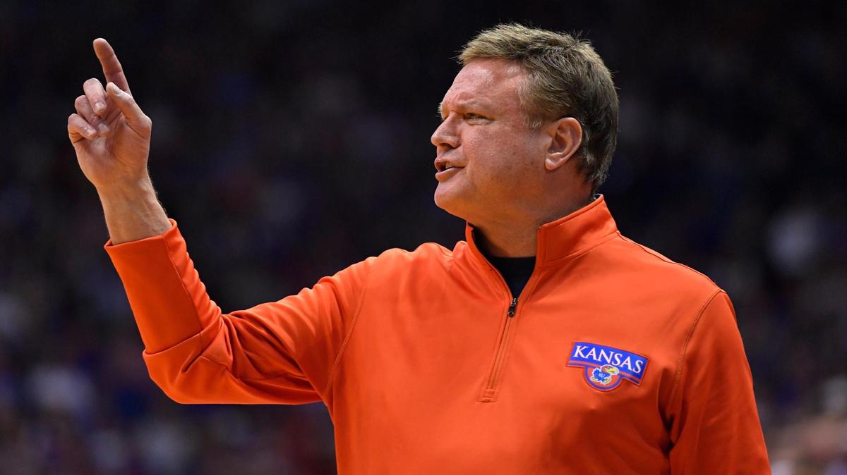 Kansas coach Bill Self signals a play to his team during the second half of the Jayhawks’ 70-63 overtime win Saturday at Allen Fieldhouse (March 5, 2022).