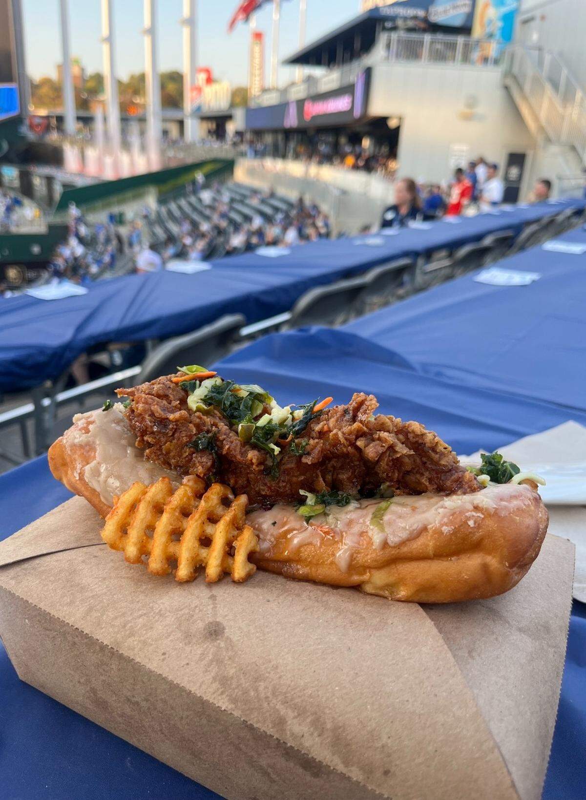 The Grand Slamwich, a long john donut with a maple glaze topped with a chicken tender tossed in gochujang sauce and pickles. It’s one of the new foods the Royals unveiled for the MLB playoffs.