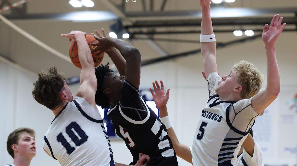 Blue Valley North’s Jackson Reis (10) and Colton Nichols (5) go up for a block against Wichita Heights during 810 Varsity Showcase 42 on Saturday, Jan. 3, 2026.