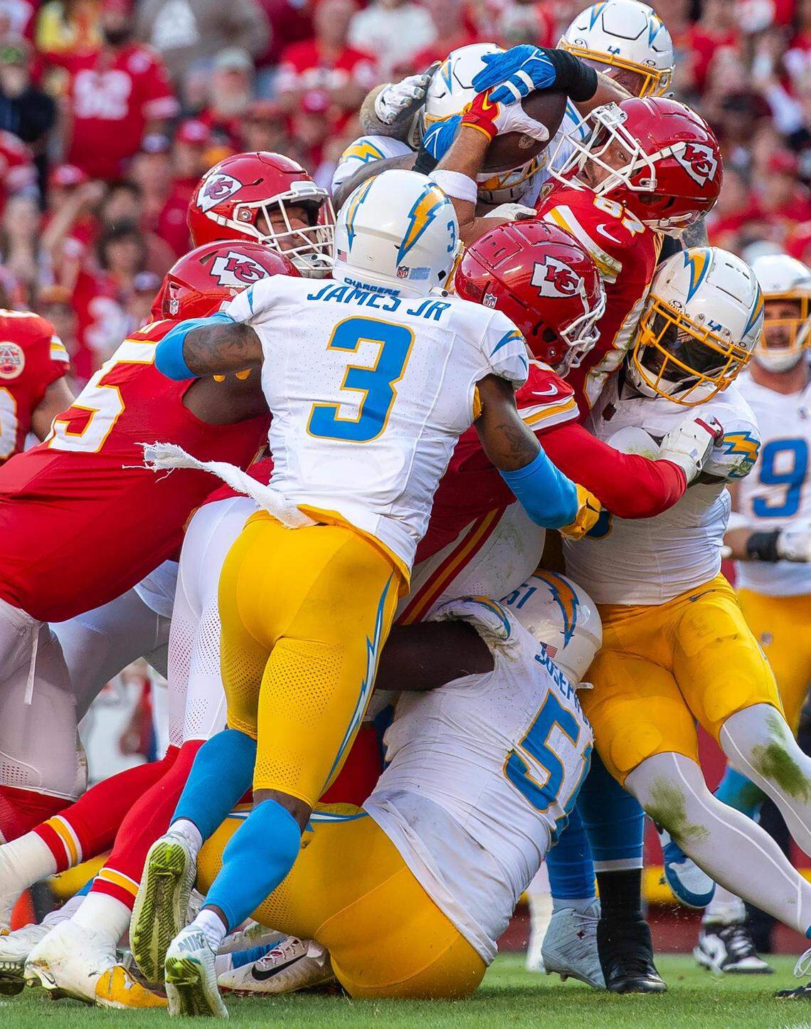 In the third frame in the series, we start to see Kelce’s face and his determined expression. At this point the Chargers player on the other side of the pile has his hands on the ball. It’s another frame that had everything going for it that could have told the story well.