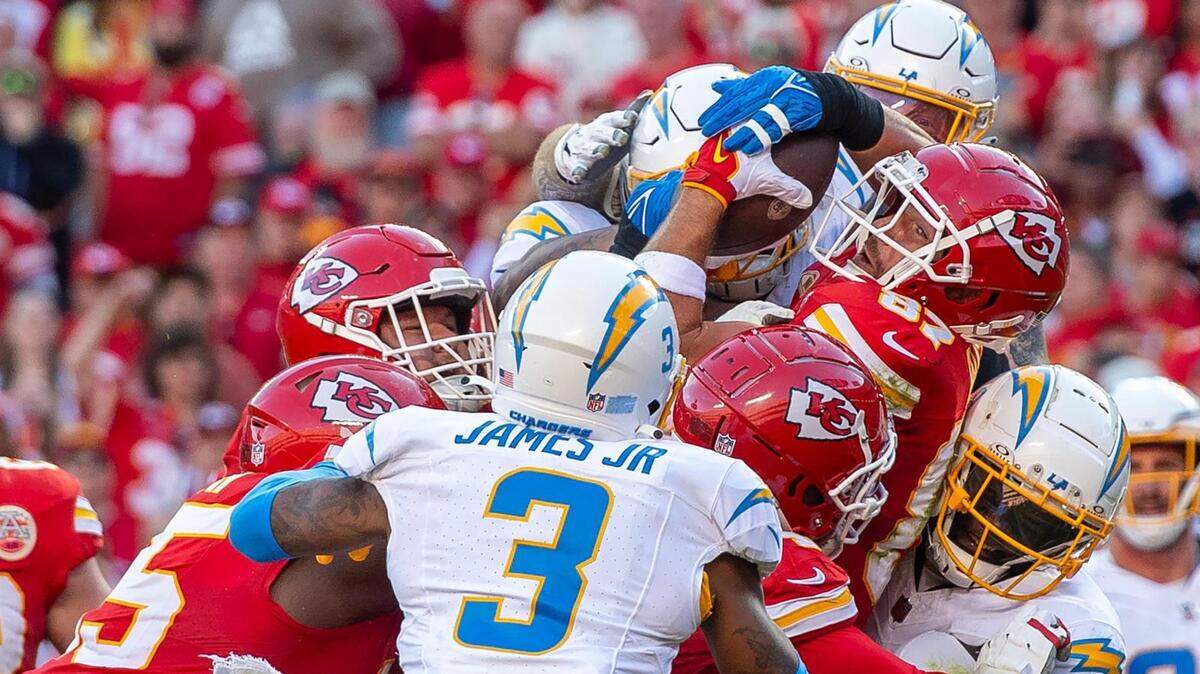 Kansas City Chiefs tight end Travis Kelce (87) eyes the goal line as his offensive line pushes him over for a touchdown against the Los Angeles Chargers during an NFL football game at GEHA Field at Arrowhead Stadium on Sunday, Oct. 22, 2023, in Kansas City.