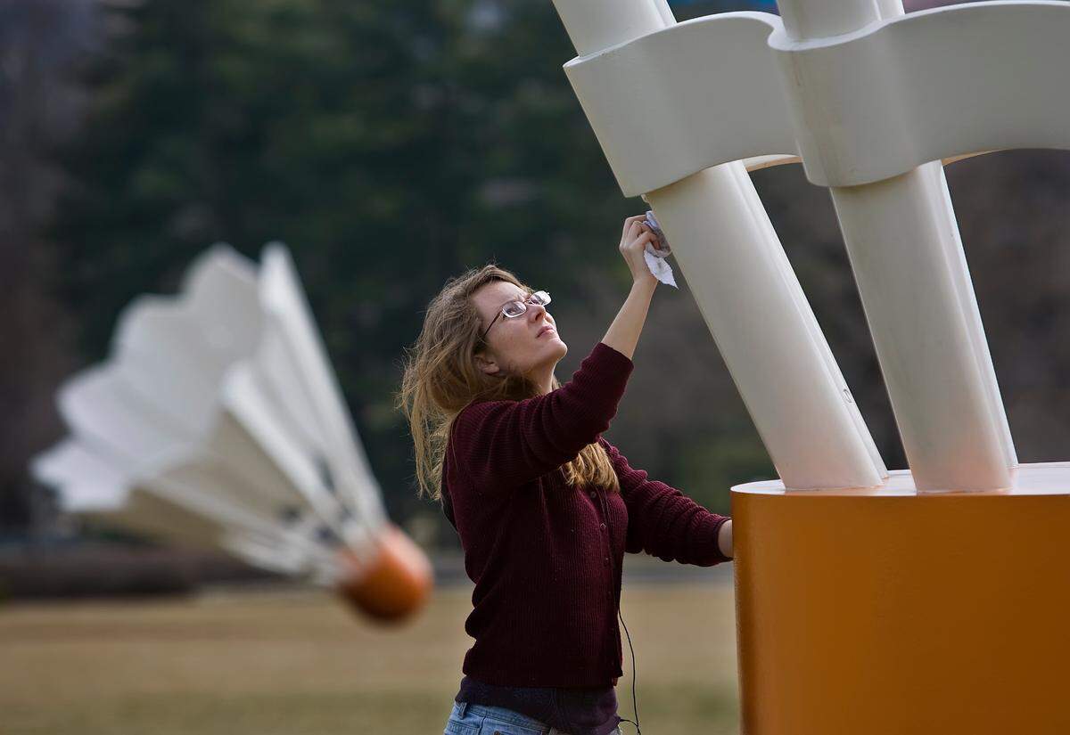 Being out in the elements, the Nelson-Atkins shuttlecocks need regular cleaning. In early 2010, Anna Zimmerman, a sculpture technician at the museum, wiped down winter’s grime.