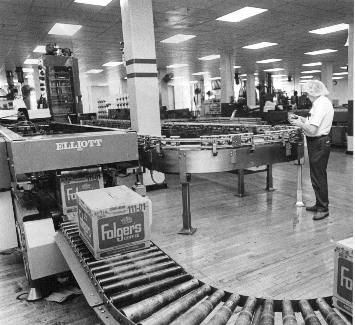 A quality control operator examines a can of coffee at the Kansas City Folger’s plant in 1979.