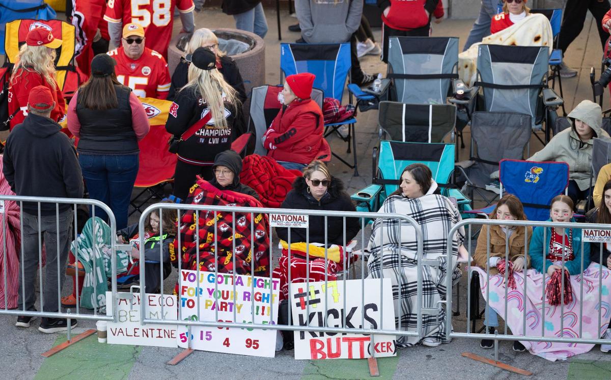 Chiefs fans gather along Grand Boulevard hours before the start of the Super Bowl parade on Wednesday.
