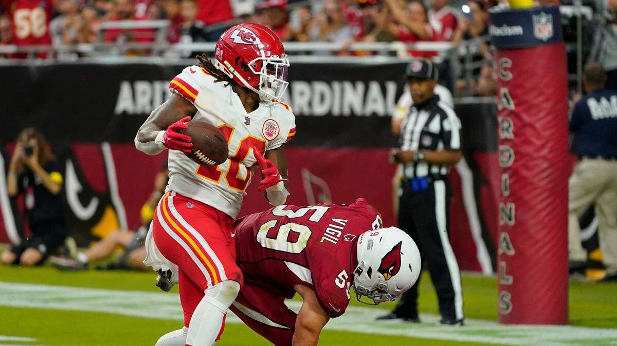 Kansas City Chiefs running back Isiah Pacheco (10) scores a touchdown against Arizona Cardinals’ Nick Vigil during the second half of an NFL football game, Sunday, Sept. 11, 2022, in Glendale, Ariz. (AP Photo/Matt York)