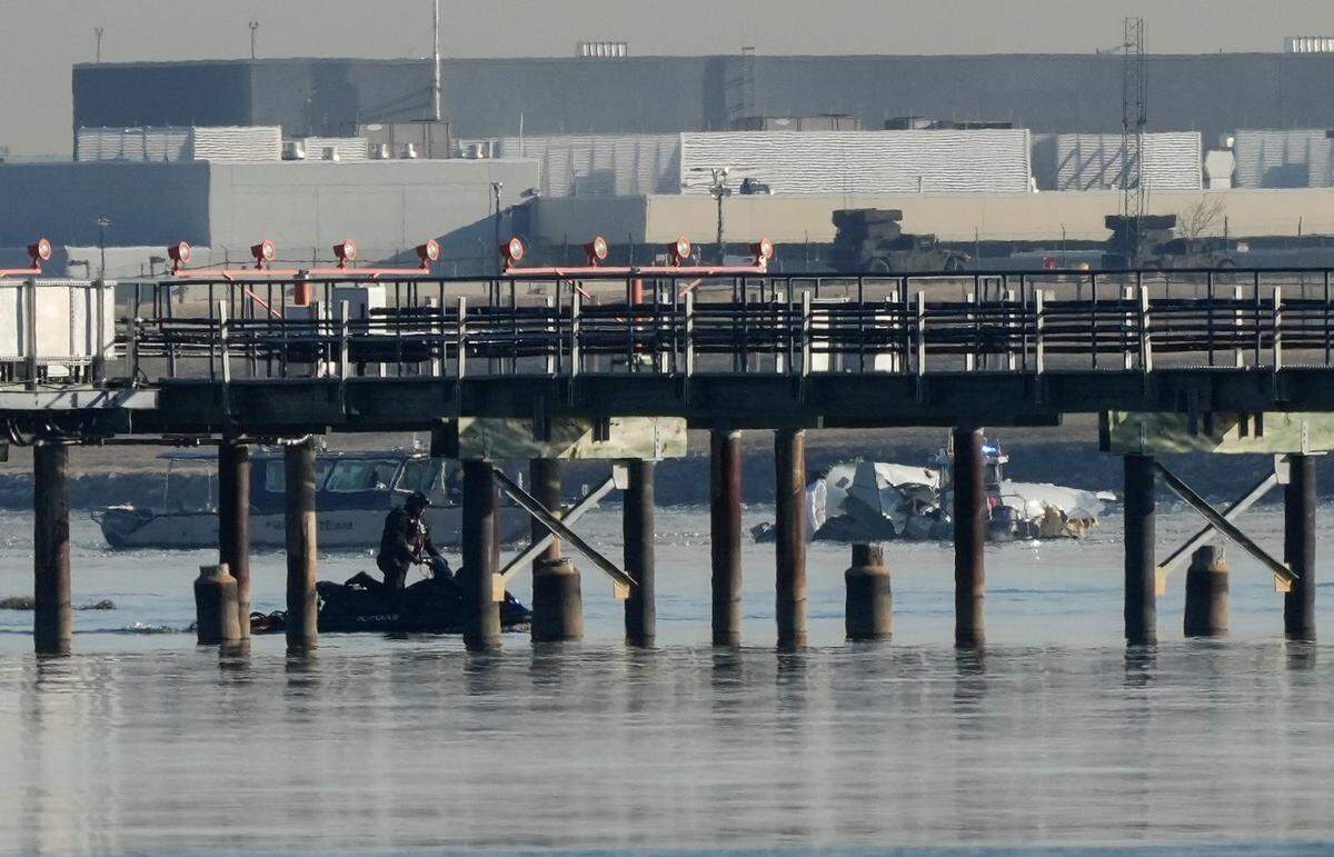 Aircraft wreckage could be seen while recovery efforts were underway in the Potomac River on Thursday near Reagan National Airport following the crash of an American Airlines plane and a military helicopter that happened Wednesday night.