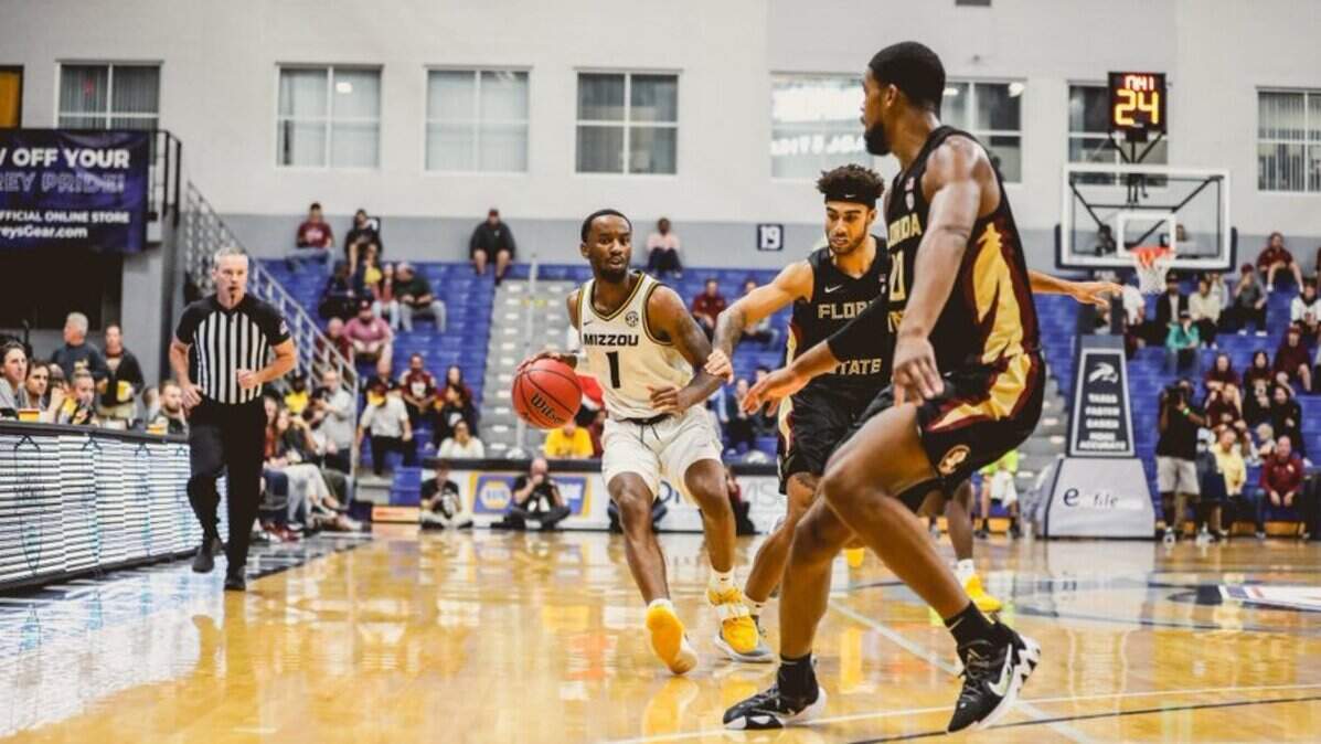 Guard Amari Davis tries to dribble past Florida State defenders during the Missouri Tigers’ loss in the Jacksonville Classic on Nov. 22.