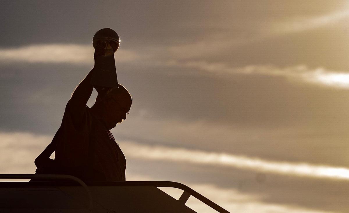Chiefs’ head coach Andy Reid holds up the Vince Lombardi Trophy while stepping off a charter flight at Kansas City International Airport on Monday. The Kansas City Chiefs returned home after defeating the Philadelphia Eagles in Super Bowl LVII in Glendale, Ariz.
