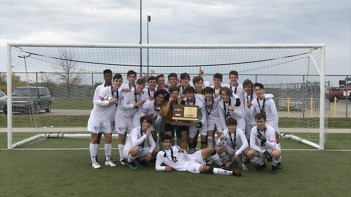 The Olathe East team was all smiles after winning the Kansas Class 6A state championship on Saturday at the College Boulevard Activity Center.