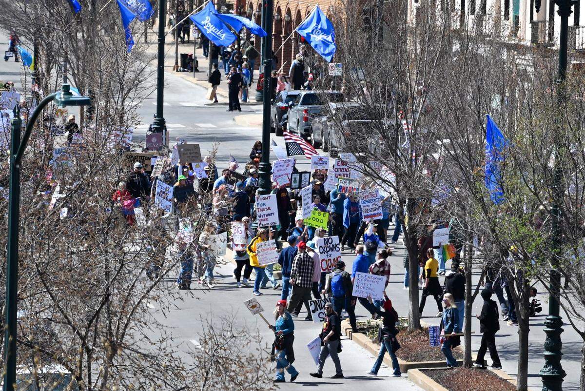 Protesters marched on the Country Club Plaza on Saturday, March 28, 2026, for a No Kings protest against the Trump administration in Kansas City.
