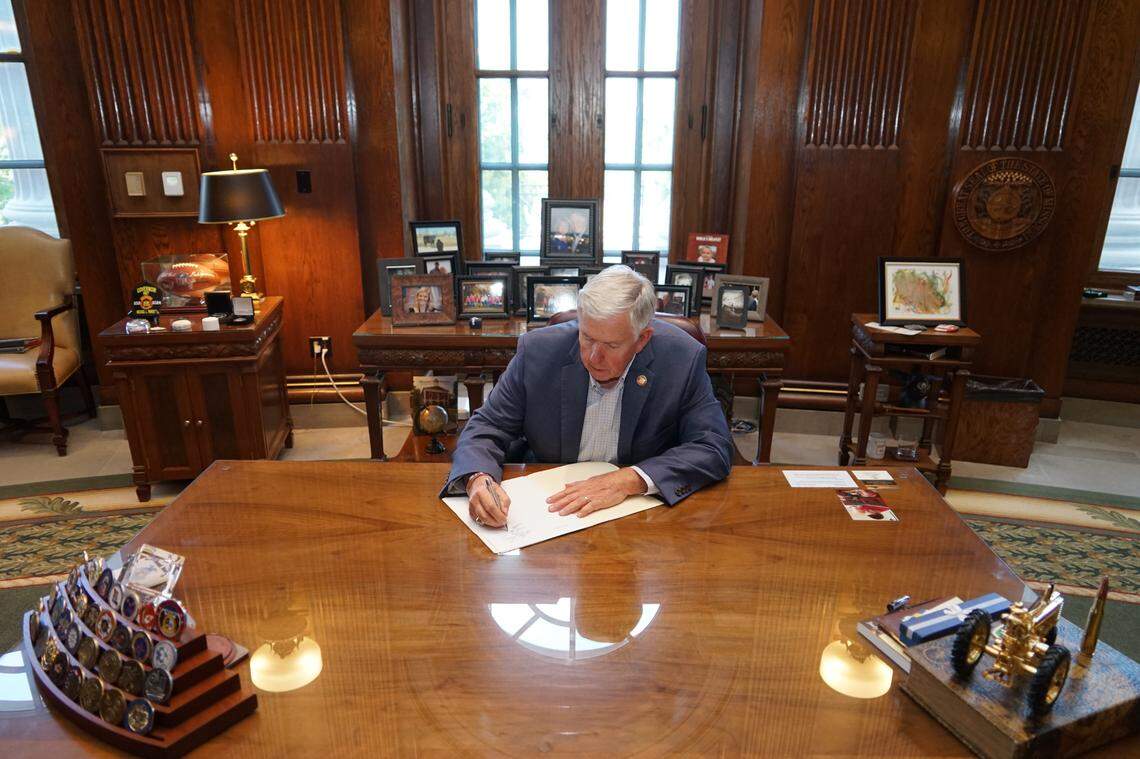 Missouri Gov. Mike Parson signs a $50.5 billion budget for the 2025 fiscal year in his Capitol office.