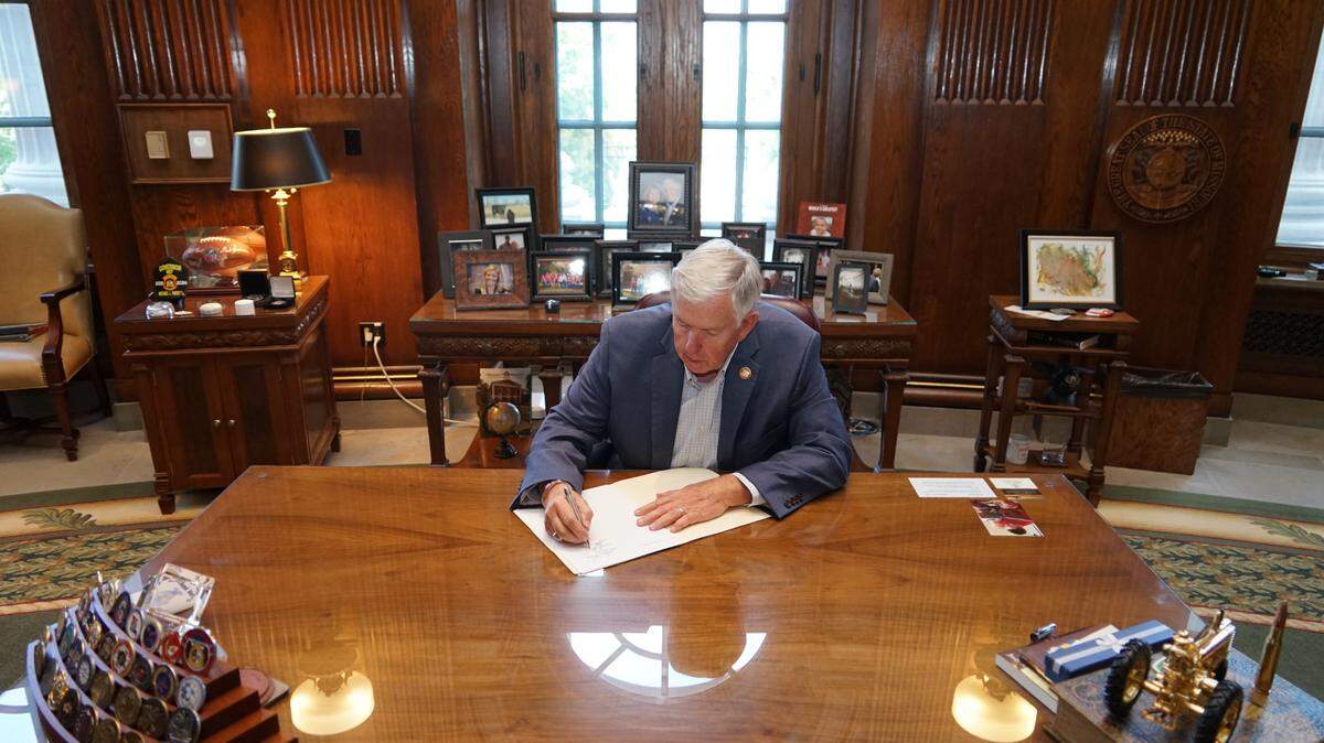 Missouri Gov. Mike Parson signs a $50.5 billion budget for the 2025 fiscal year in his Capitol office.