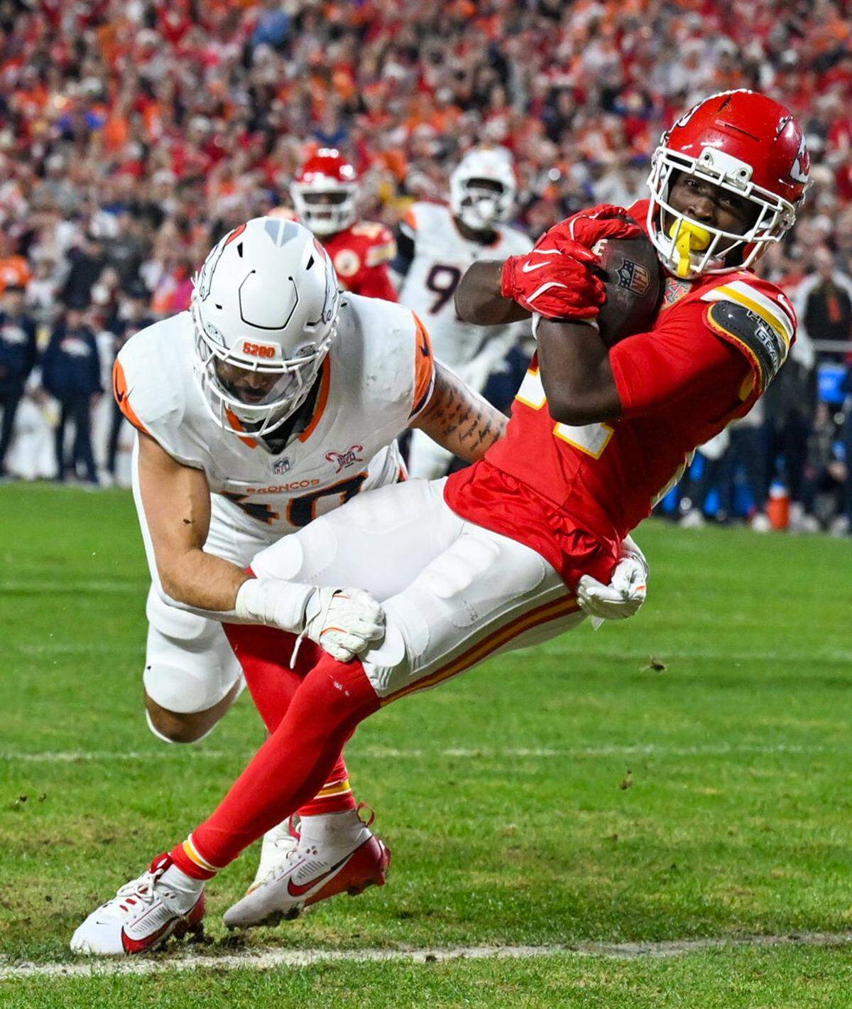 Kansas City Chiefs running back Brashard Smith (24) is tackled after a catch in the first half of the game against the Denver Broncos at GEHA Field at Arrowhead Stadium on Thursday, Dec. 25, 2025.