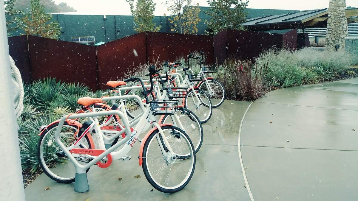 The JoCo Park and Recreation District has placed 34 orange and white bicycles around the county to get residents acquainted with a new bike-sharing program that will be fully deployed next year.