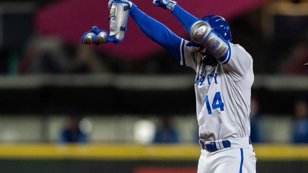 Kansas City Royals’ Edward Olivares celebrates after hitting an RBI double off Seattle Mariners relief pitcher Yohan Ramirez during the seventh inning of a baseball game Saturday, April 23, 2022, in Seattle. (AP Photo/Stephen Brashear)