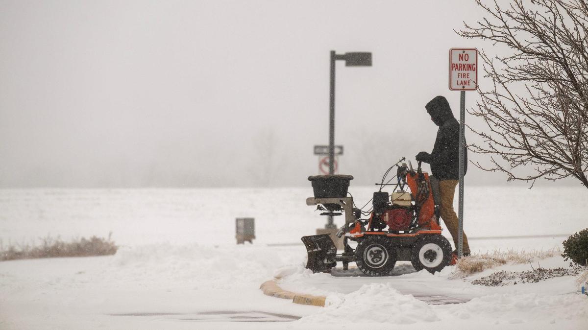 A crew member from Green Lawn, a landscape company in Shawnee, faced the daunting job of snow removal from a shopping center near Kansas 10 Highway and Woodland Rd., western Lenexa on Sunday, Jan. 5, 2025.
