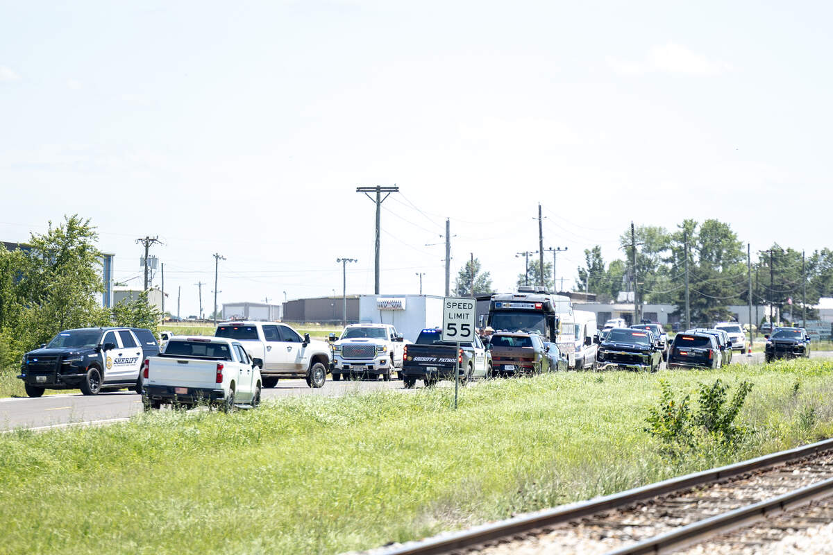 A large law enforcement presence can be seen staging near the Butler Memorial Airport, after a plane crashed on Sunday, June 14, 2026, killing 11 skydivers and a pilot.
