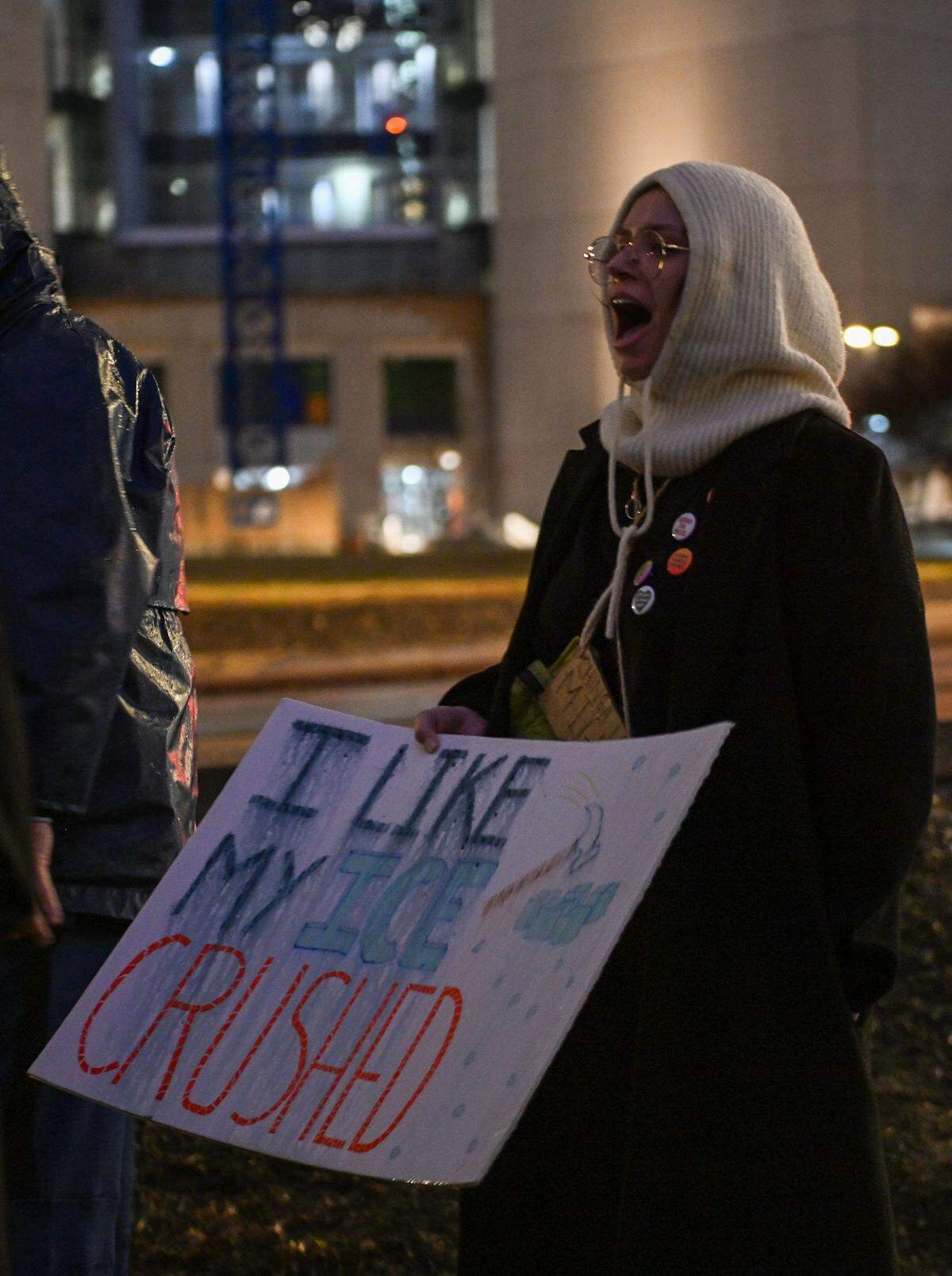 A protester holds up a sign as crowds rally against ICE outside City Hall in Kansas City on Thursday, Jan. 8. An ICE agent shot and killed Renee Good, a former KC resident, in Minneapolis on Wednesday, Jan. 7.