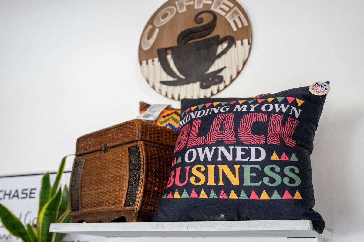 Trinkets are displayed on shelves around Equal Minded Cafe in Kansas City.