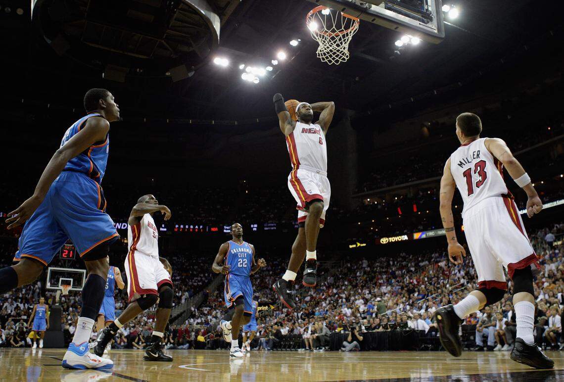 Miami Heat superstar LeBron James throws down a dunk during a game against the Oklahoma City Thunder on Oct. 8 2010 in Kansas City.