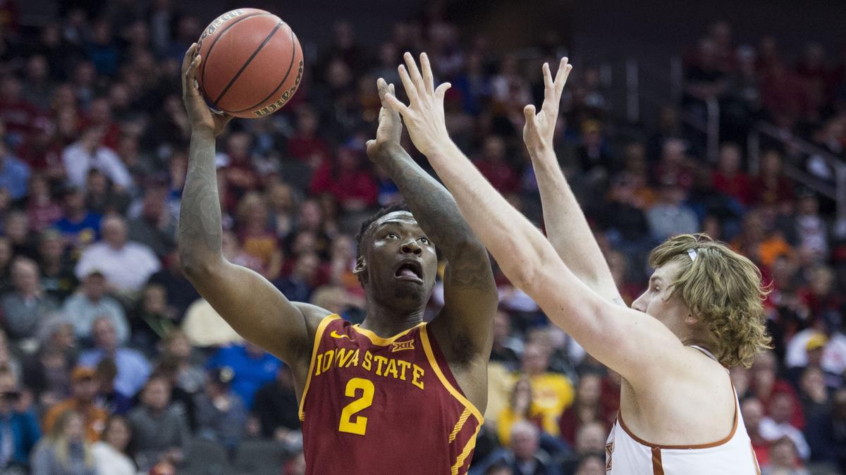 Iowa State forward Cameron Lard tried to get a shot off against Texas forward Dylan Osetkowski in the first half of Wednesday night's Big 12 Tournament first-round game at the Sprint Center.