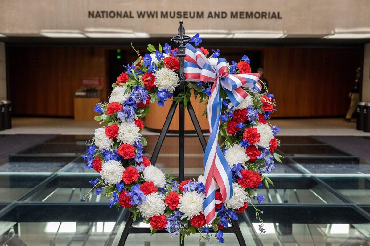 A wreath left in honor of Veterans Day rests on the glass platform at the entrance to the main exhibit hall at the National WWI Museum and Memorial on Tuesday, Nov. 11, 2025.