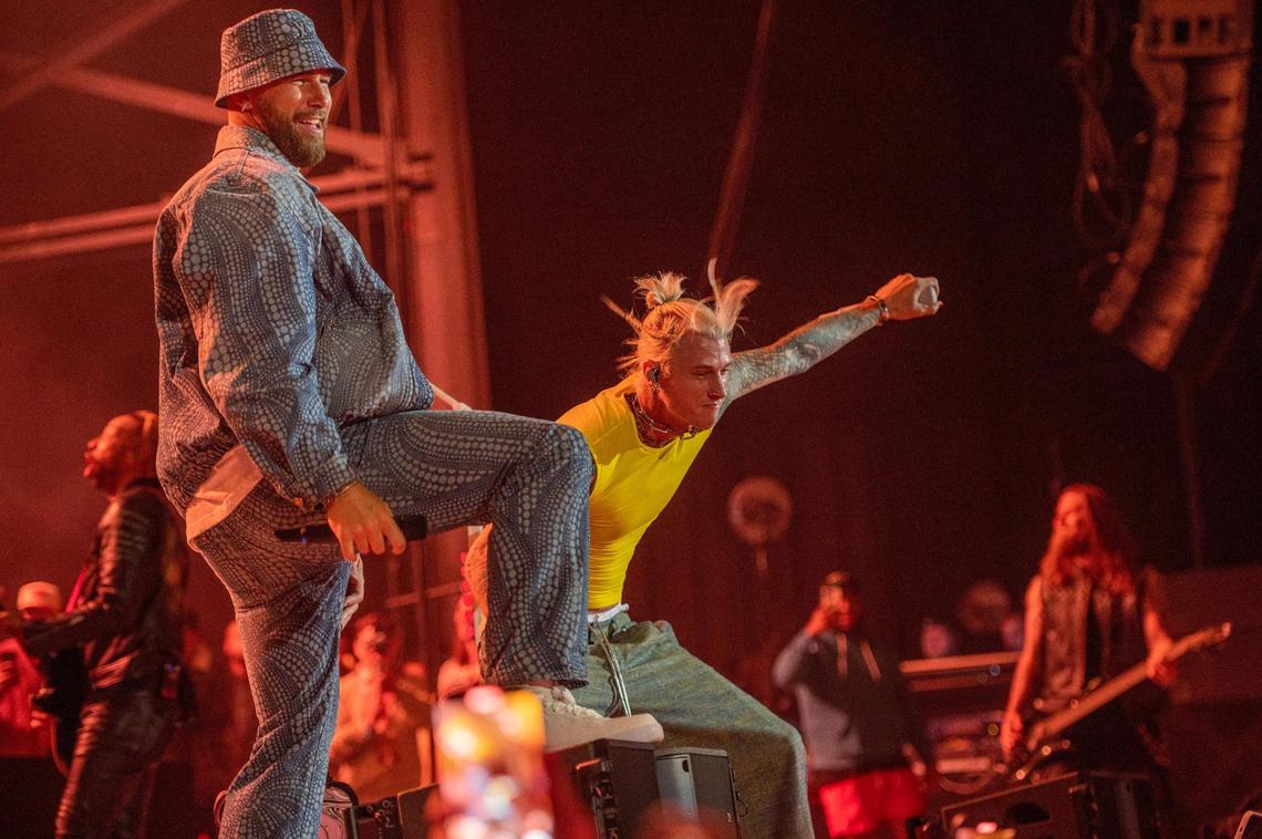 Travis Kelce, left, and Machine Gun Kelly rock out to the Beastie Boys, “Fight For Your Right,” at Kelce Jam at the Azura Amphitheater on Friday, April 28, 2023, in Bonner Springs.