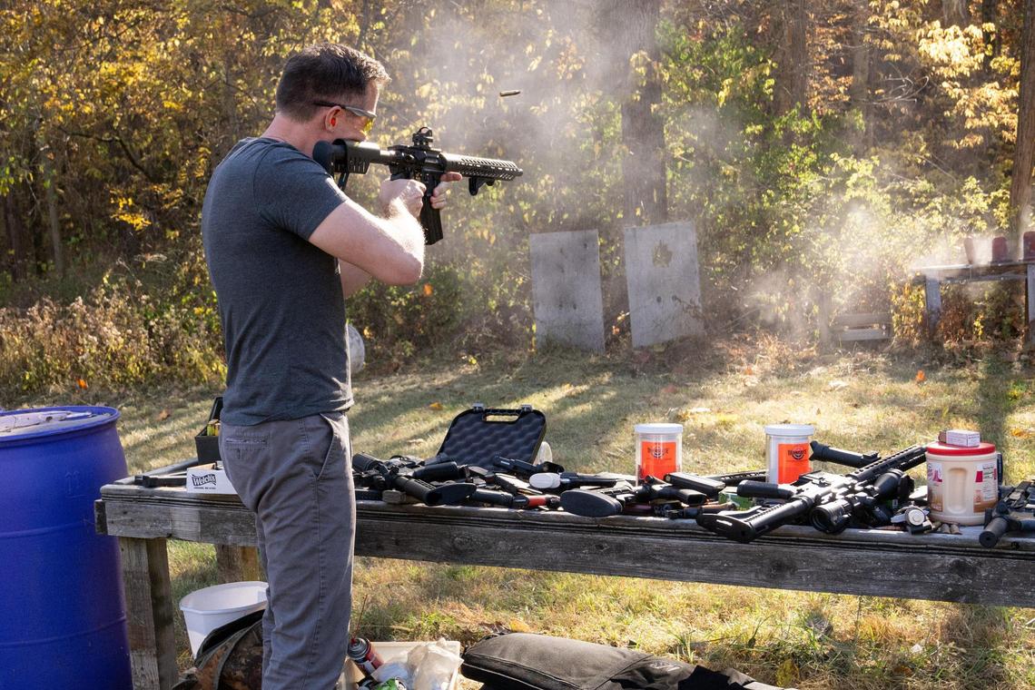 Missouri Democratic candidate for U.S. Senate Lucas Kunce fires rounds from a custom AR15 during a sport shooting campaign event Tuesday, Oct. 22, 2024 in Holt, Missouri.
