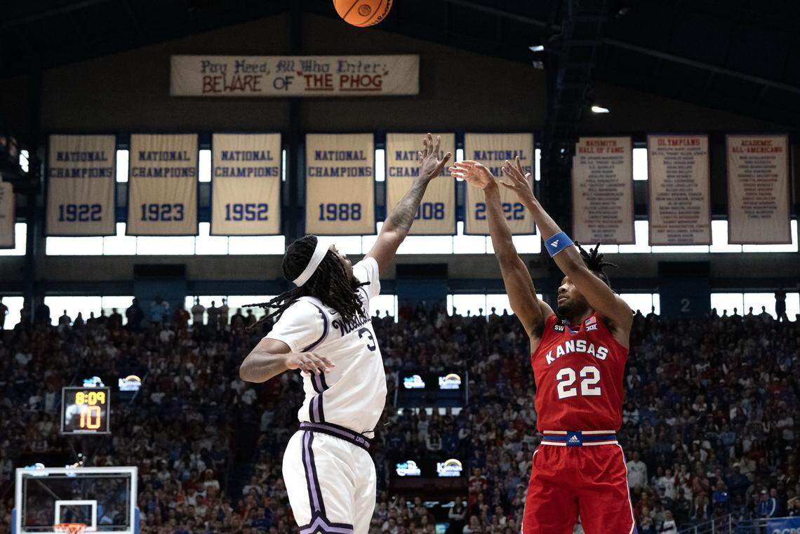 Kansas Jayhawks guard Darryn Peterson (22) gets off a 3-point shot as Kansas State Wildcats guard CJ Jones (3)defends in the first half at Allen Fieldhouse on Saturday, March 7, 2026, in Lawrence, Kansas.