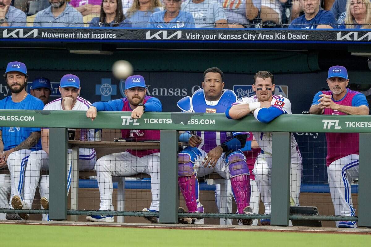 Kansas City Royals players are pictured in the dugout wearing the team's new "Forever Fountains" City Connect uniforms before a game against the Houston Astros on Friday, June 12, 2026, at Kauffman Stadium in Kansas City.