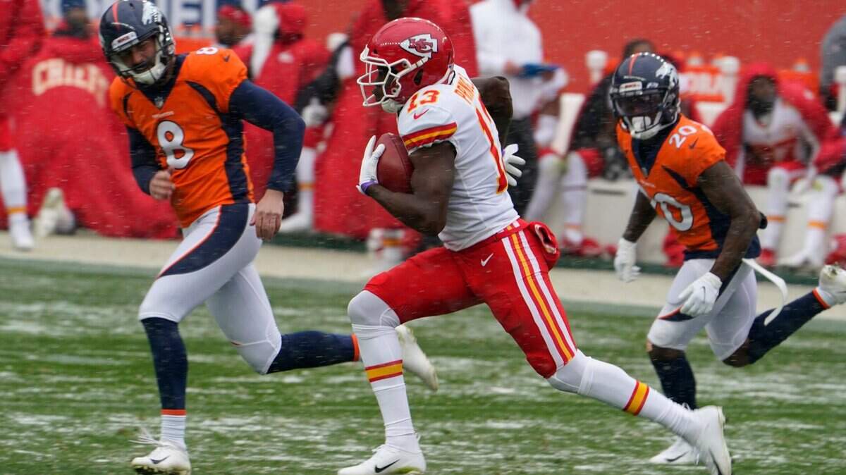Kansas City Chiefs return man Byron Pringle, the K-State product, runs a kickoff back for a 102-yard touchdown as Denver Broncos kicker Brandon McManus, left, and cornerback Duke Dawson give chase Sunday.