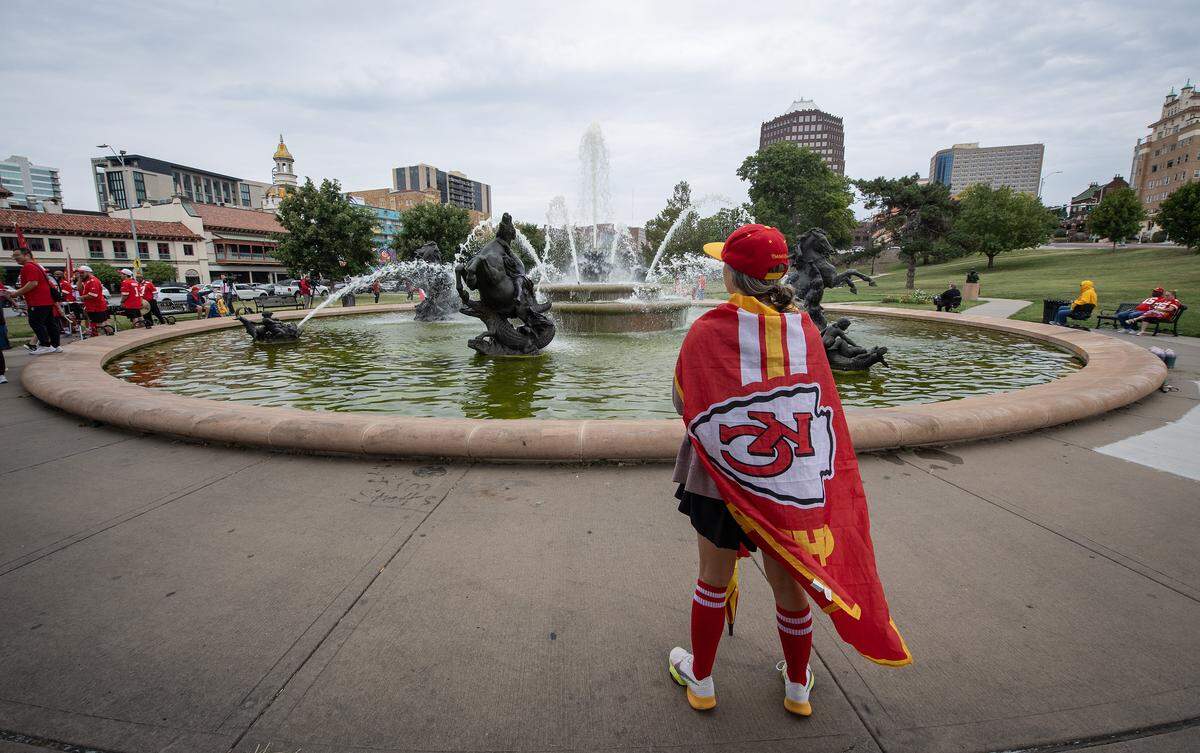 Kansas City Chiefs fan Lesley Thalman waited by the fountain at Mill Creek Park to see it dyed red to kick off the Red Friday celebrations on Friday, Sept. 5, 2024, in Kansas City.
