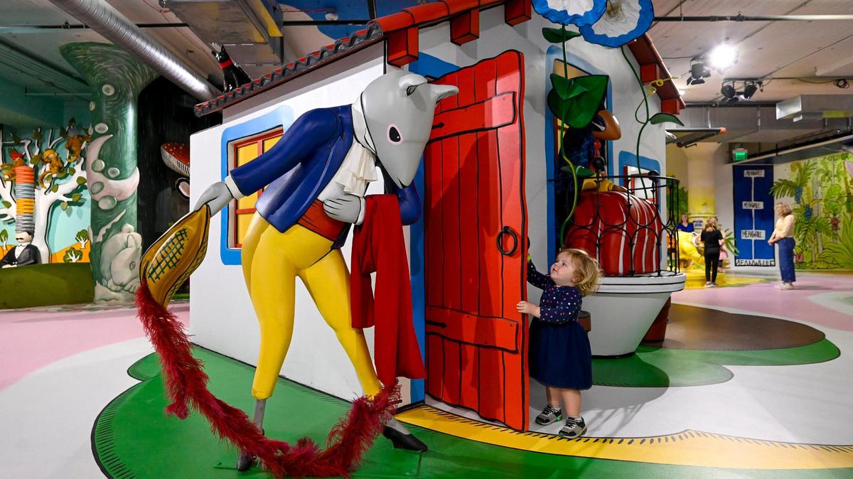 Silas Reynolds, 3, of Liberty, popped out of the exhibit for the book “Perez and Martina,” at The Rabbit hOle.