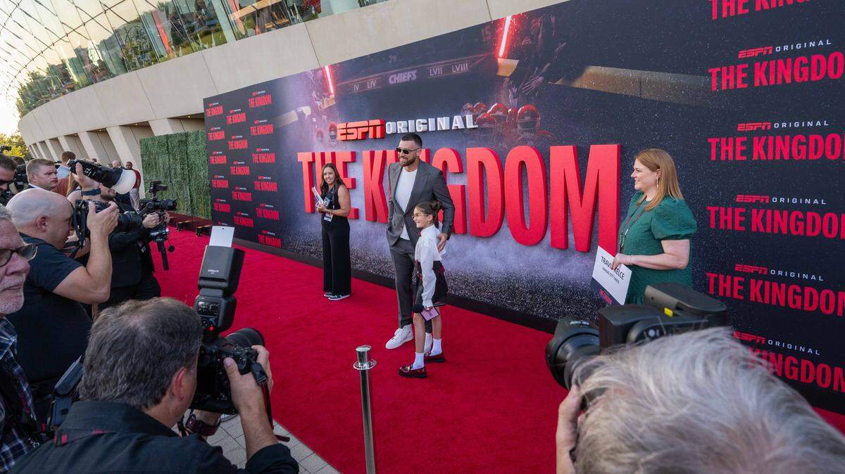 Kansas City Chiefs tight end Travis Kelce posed with 12-year-old content creator Taylen Biggs on the red carpet before the screening of the ESPN series “The Kingdom” on Sunday at the Kauffman Center for the Performing Arts.