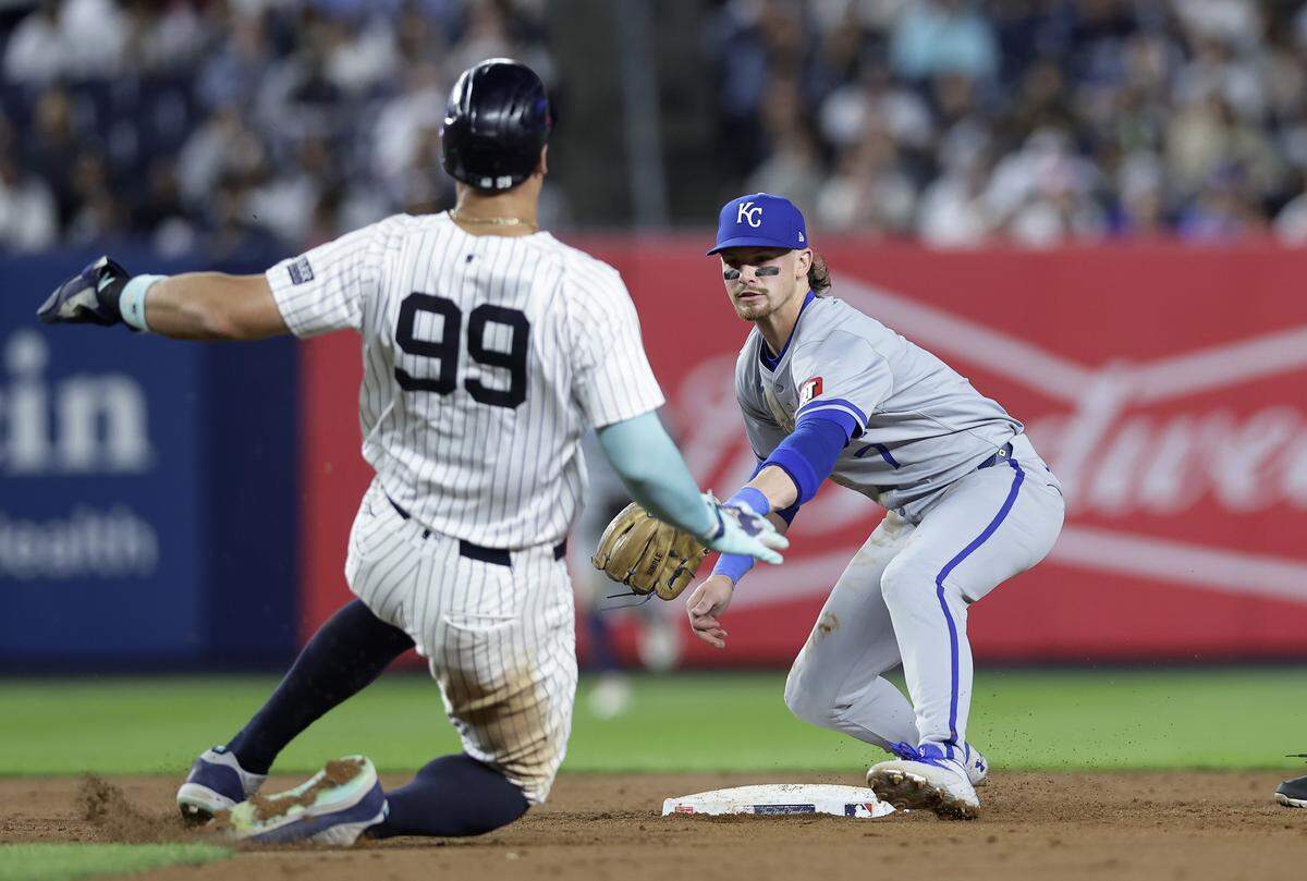 Bobby Witt Jr. #7 of the Kansas City Royals tags out Aaron Judge #99 of the New York Yankees to complete a fifth inning ending double play at Yankee Stadium on September 09, 2024 in the Bronx borough of New York City.