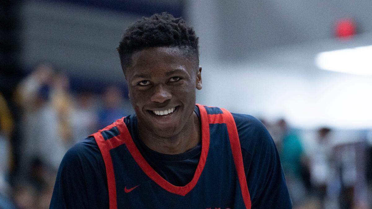Kokomo Wildkats center Flory Bidunga (40) laughs during the Sneakers for Santa Shootout Saturday, Dec. 3, 2022, at Brownsburg High School.