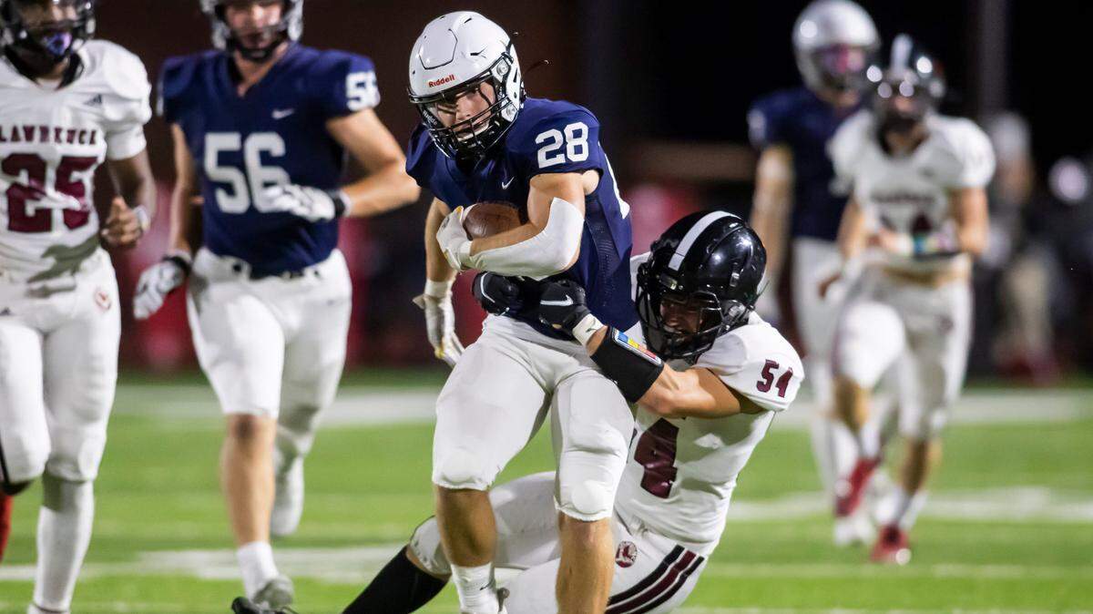 Mill Valley senior running back Reice Kennedy attempts to break the tackle of Lawrence junior linebacker Nathan Bletner the game between the Lawrence Chesty Lions and the Mill Valley Jaguars on Friday September 24, 2021 in Shawnee, Kansas. (Nick Tre. Smith/Special to the Star)
