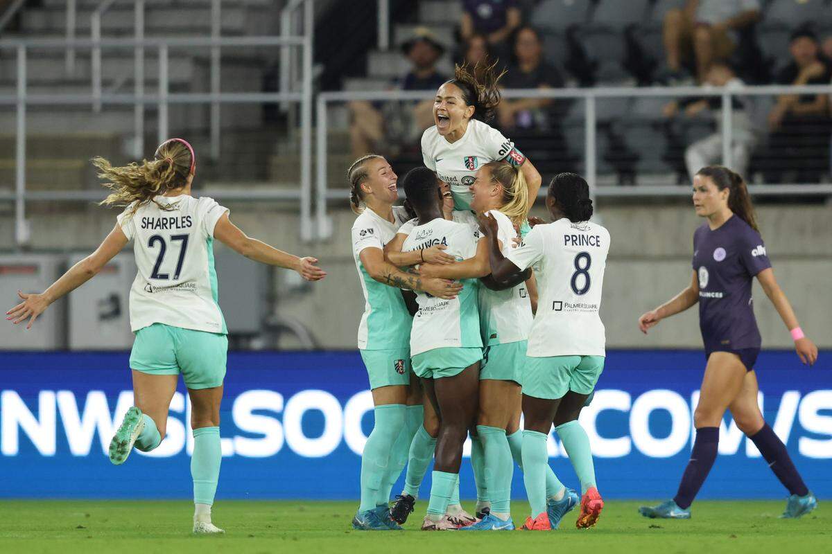 Teammates celebrate Kansas City Current midfielder Vanessa DiBernardo’s goal Saturday against Racing Louisville FC at Lynn Family Stadium in Kentucky.