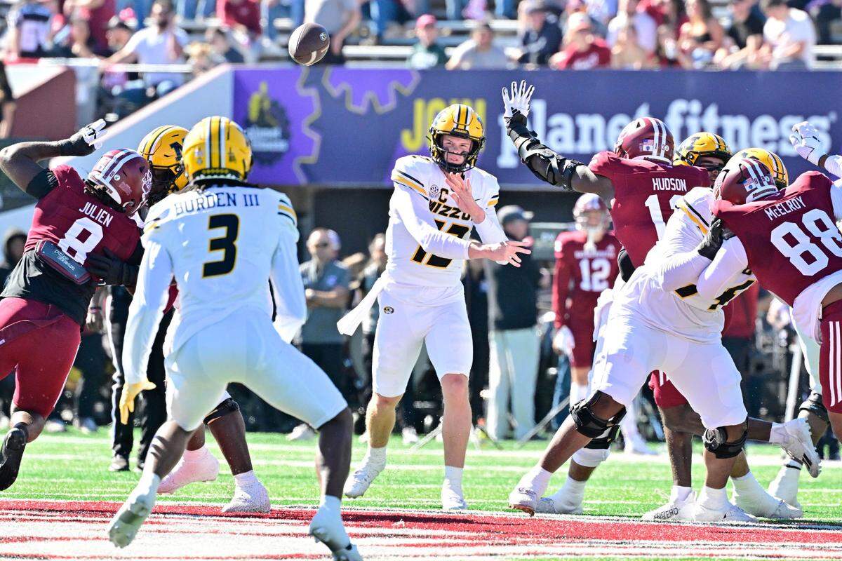 Missouri Tigers quarterback Brady Cook throws a pass to wide receiver Luther Burden III during Saturday’s game against the Massachusetts Minutemen at Warren McGuirk Alumni Stadium in Amherst, Mass.