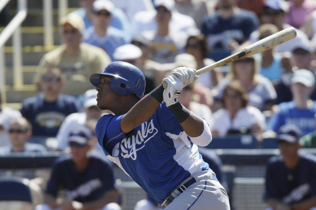Kansas City Royals’ Salvador Perez watches after hitting a fly ball against the Milwaukee Brewers during the first inning of a spring training baseball game Sunday, March 13, 2011, in Phoenix. (AP Photo/Nam Y. Huh) ORG XMIT: NYOTK