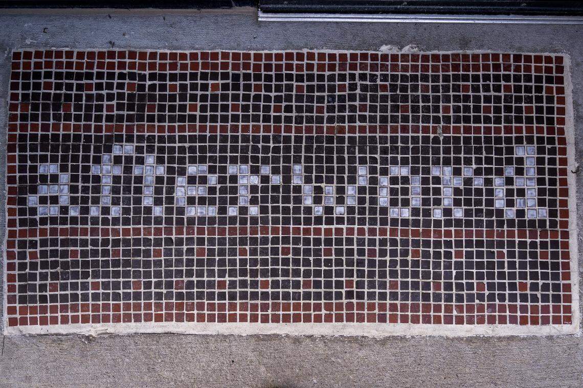 A mosaic spelling out “Afterword” is seen at the main entrance on Wednesday, Dec. 3, 2025, in Kansas City.